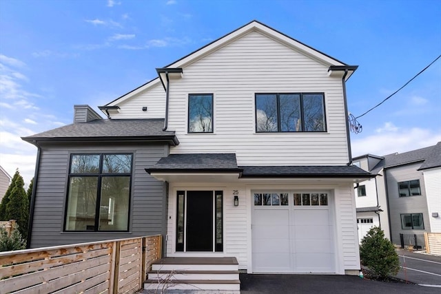 25 Johnson Pl Unit 25, Newton, MA 02466 - view of front facade with a shingled roof, a garage, entry steps, and asphalt driveway