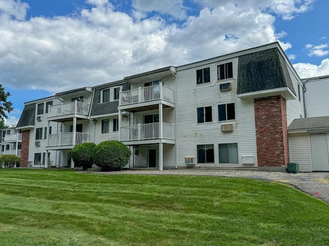 view of building exterior with central AC unit