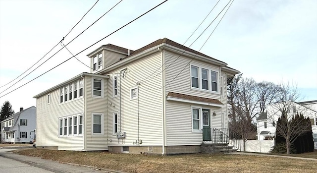 view of home's exterior with a lawn