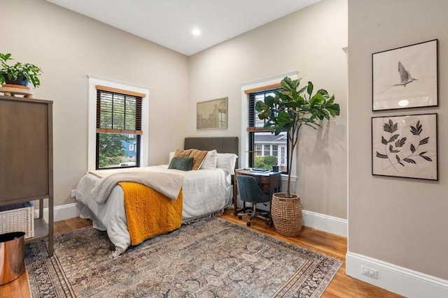 332 Eliot St, Milton, MA 02186 - bedroom with wood finished floors, an office area, and recessed lighting