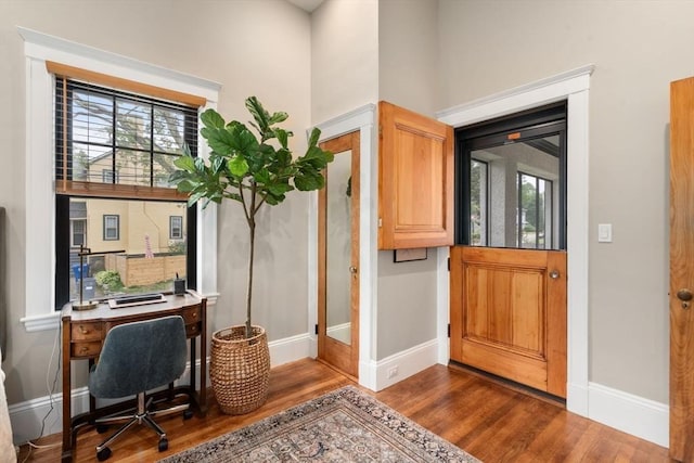 332 Eliot St, Milton, MA 02186 - office area featuring dark wood-style flooring and healthy amount of natural light
