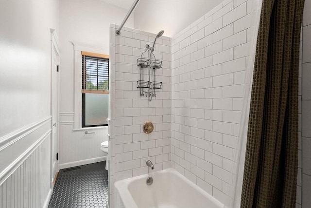 332 Eliot St, Milton, MA 02186 - bathroom featuring tile patterned flooring, shower / bath combo with shower curtain, and a wainscoted wall