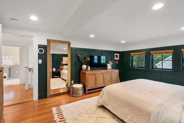 332 Eliot St, Milton, MA 02186 - bedroom with light wood-style floors, recessed lighting, and a decorative wall