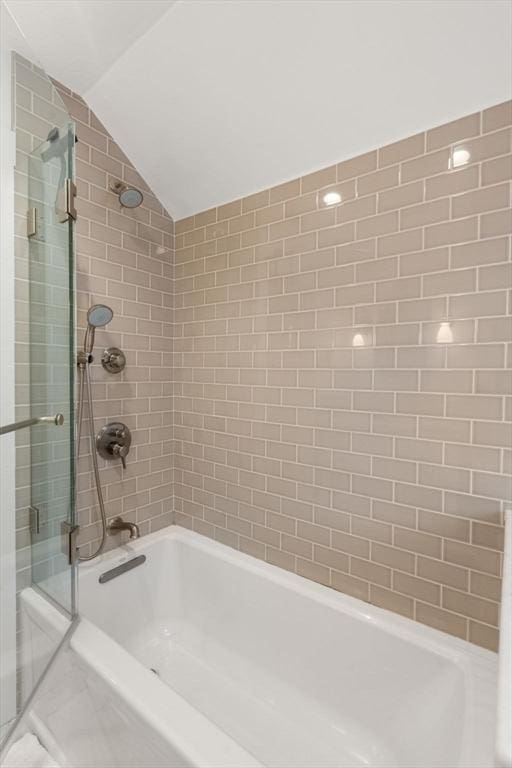 332 Eliot St, Milton, MA 02186 - full bathroom with vaulted ceiling and bathing tub / shower combination