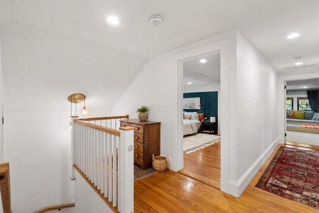 332 Eliot St, Milton, MA 02186 - corridor featuring light wood-style flooring, recessed lighting, an upstairs landing, and lofted ceiling