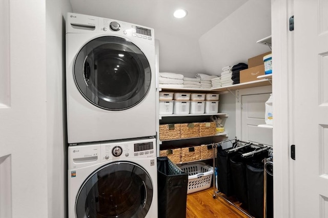 332 Eliot St, Milton, MA 02186 - laundry room featuring estacked washer and dryer and wood finished floors