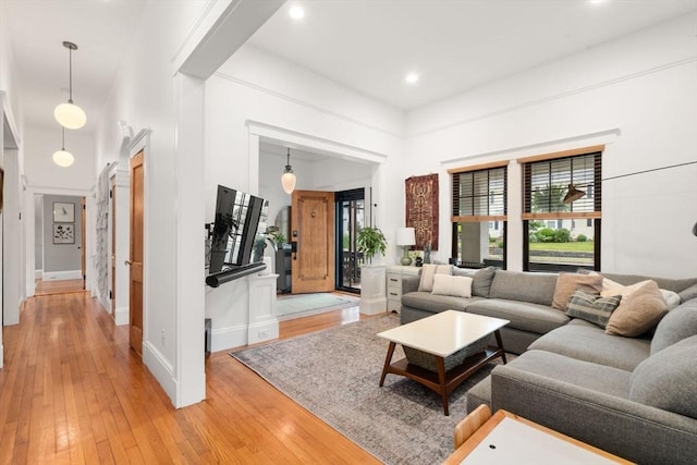 332 Eliot St, Milton, MA 02186 - living room with light wood-style floors, a high ceiling, and recessed lighting
