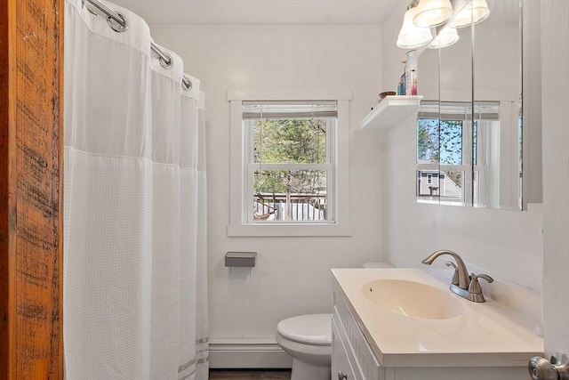 full bathroom featuring vanity, toilet, a healthy amount of sunlight, and a baseboard radiator