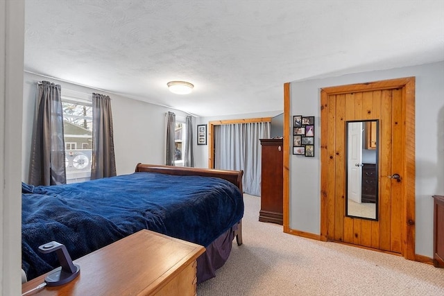 carpeted bedroom with baseboards