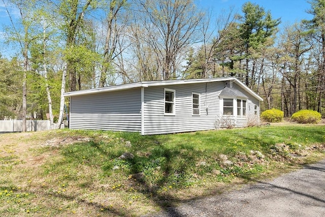 view of home's exterior featuring a yard