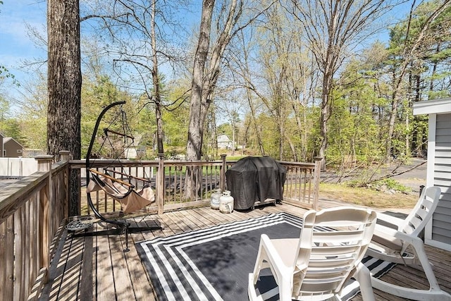 wooden deck with grilling area