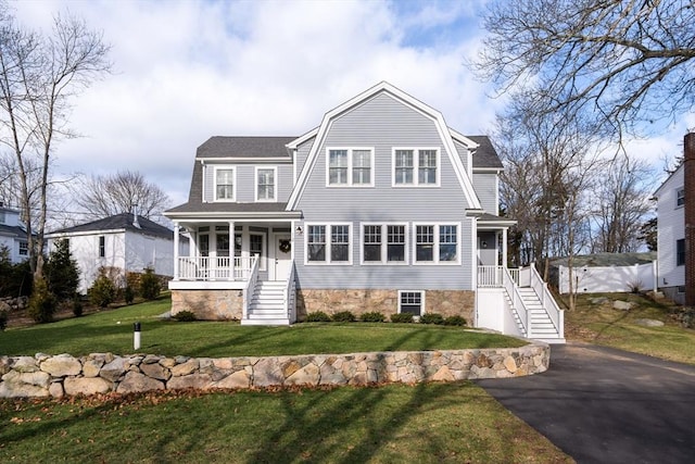 view of front of house with a front lawn and covered porch