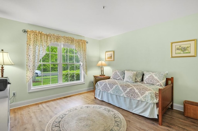 179 Hillside Village Dr Unit 179, West Boylston, MA 01583 - bedroom with baseboards and wood finished floors