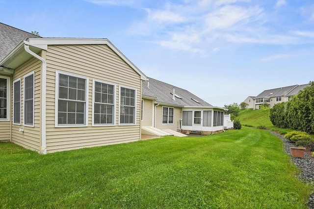 179 Hillside Village Dr Unit 179, West Boylston, MA 01583 - rear view of property featuring a yard, a sunroom, and roof with shingles