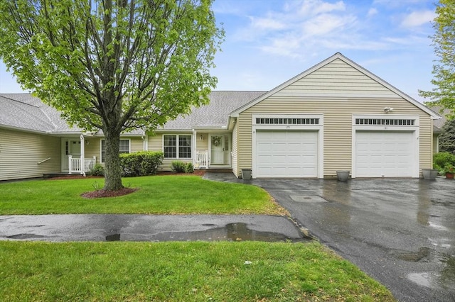 179 Hillside Village Dr Unit 179, West Boylston, MA 01583 - view of front of house featuring a garage, asphalt driveway, a front yard, and a shingled roof