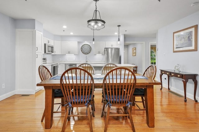 179 Hillside Village Dr Unit 179, West Boylston, MA 01583 - dining area featuring baseboards, light wood-style flooring, and recessed lighting