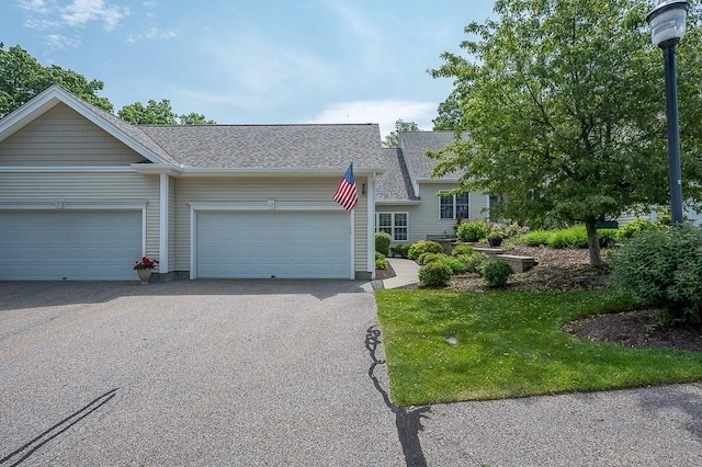17 Cortland Grove Dr Unit 17, Shrewsbury, MA 01545 - view of front of property with an attached garage, asphalt driveway, and a shingled roof