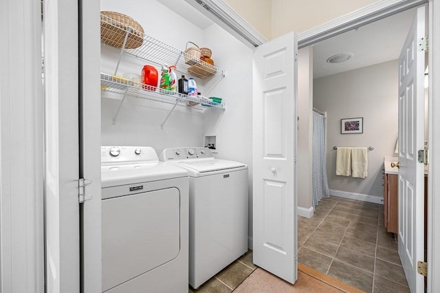 17 Cortland Grove Dr Unit 17, Shrewsbury, MA 01545 - laundry room with washing machine and dryer and tile patterned floors