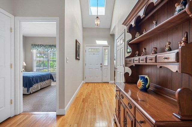17 Cortland Grove Dr Unit 17, Shrewsbury, MA 01545 - foyer entrance with light wood-style flooring, a skylight, and a towering ceiling