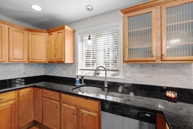 kitchen with a sink, stainless steel dishwasher, decorative backsplash, dark stone counters, and glass insert cabinets