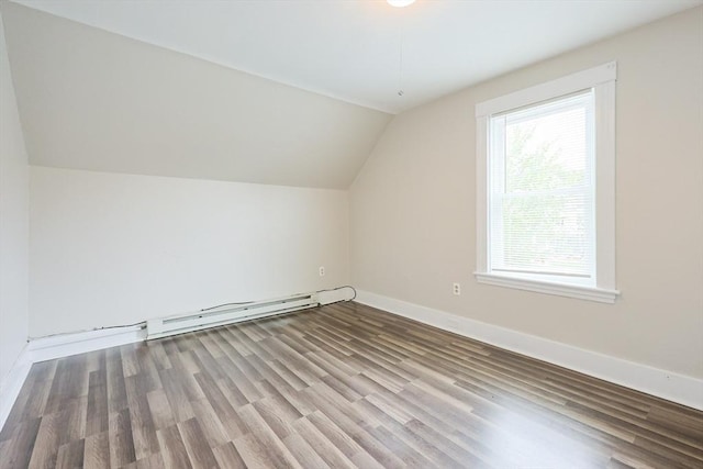 bonus room with a baseboard radiator, vaulted ceiling, wood finished floors, and baseboards