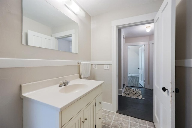 bathroom with vanity and baseboards