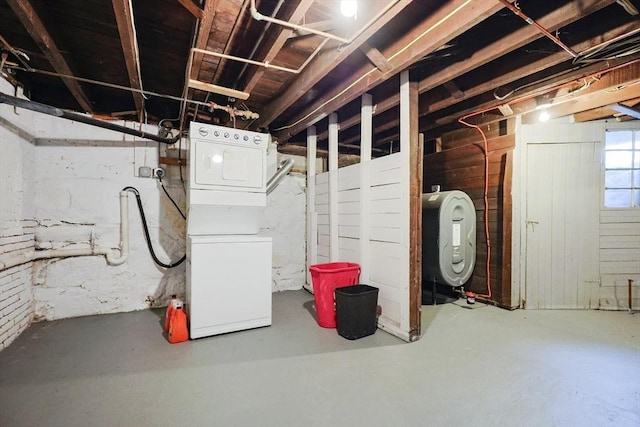 below grade area featuring heating fuel and washer / dryer