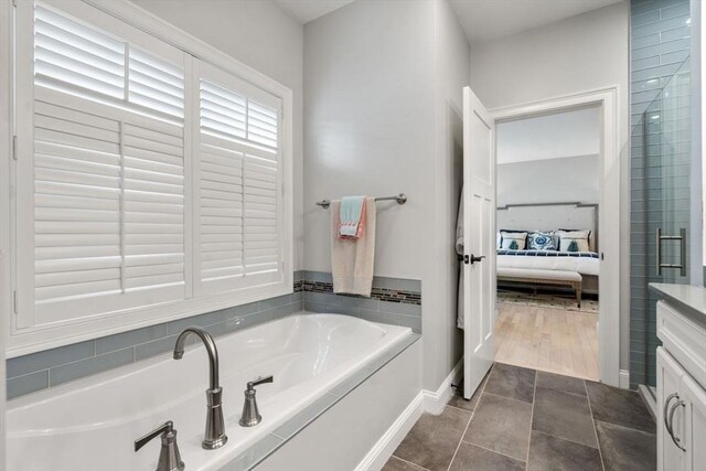 7 Bethpage Ln, Plymouth, MA 02360 - ensuite bathroom with a bath, baseboards, and ensuite bathroom
