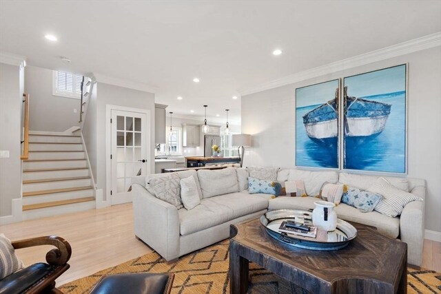 7 Bethpage Ln, Plymouth, MA 02360 - living room featuring light wood-style flooring, recessed lighting, stairs, and crown molding