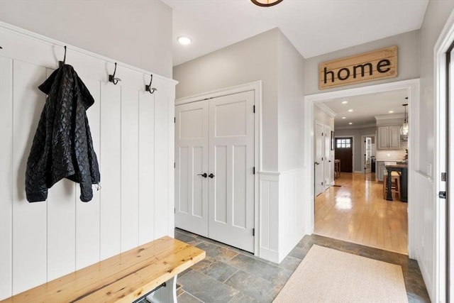 7 Bethpage Ln, Plymouth, MA 02360 - mudroom with stone finish flooring, recessed lighting, and ornamental molding