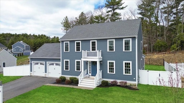 4 Barrows Brook Cir, Kingston, MA 02364 - colonial inspired home with a garage, asphalt driveway, a shingled roof, and a balcony