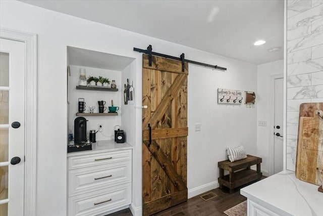4 Barrows Brook Cir, Kingston, MA 02364 - mudroom with a barn door, dark wood finished floors, baseboards, and recessed lighting