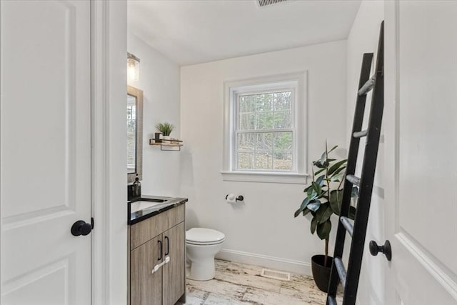4 Barrows Brook Cir, Kingston, MA 02364 - half bath with toilet, baseboards, vanity, and wood finished floors