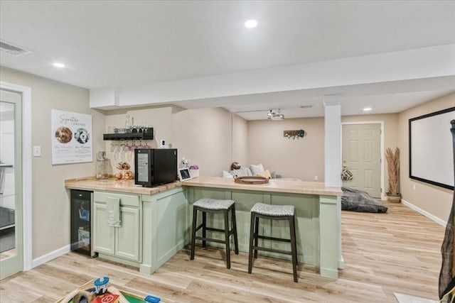 4 Barrows Brook Cir, Kingston, MA 02364 - indoor bar with beverage cooler, light wood-type flooring, baseboards, and recessed lighting