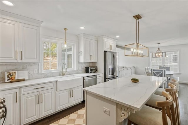 4 Barrows Brook Cir, Kingston, MA 02364 - kitchen with stainless steel appliances, a sink, dark wood-style flooring, white cabinets, and recessed lighting