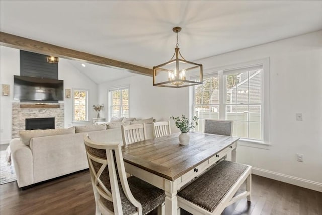 4 Barrows Brook Cir, Kingston, MA 02364 - dining space featuring a chandelier, dark wood-style floors, a stone fireplace, and baseboards
