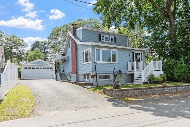 9 Crescent Ave, Lynnfield, MA 01940 - view of front of house with a detached garage, an outdoor structure, and a chimney