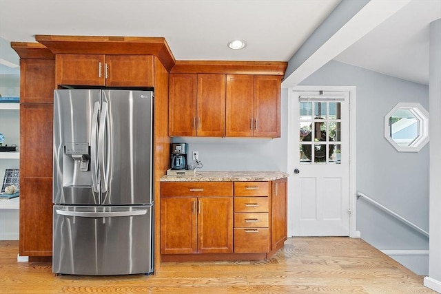 9 Crescent Ave, Lynnfield, MA 01940 - kitchen featuring stainless steel fridge with ice dispenser, light wood finished floors, light stone countertops, brown cabinetry, and recessed lighting