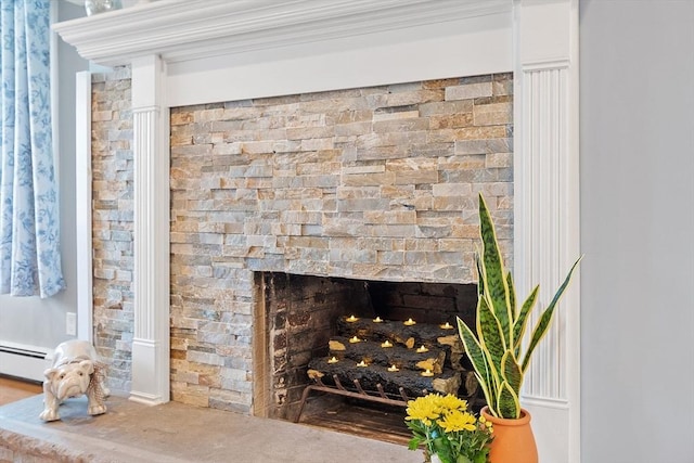 9 Crescent Ave, Lynnfield, MA 01940 - detailed view of a baseboard radiator and a warm lit fireplace
