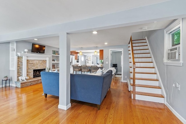 9 Crescent Ave, Lynnfield, MA 01940 - living area featuring light wood-style floors, stairway, a fireplace, and recessed lighting