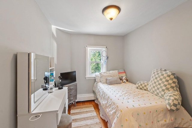 9 Crescent Ave, Lynnfield, MA 01940 - bedroom with wood finished floors, an office area, and a baseboard heating unit