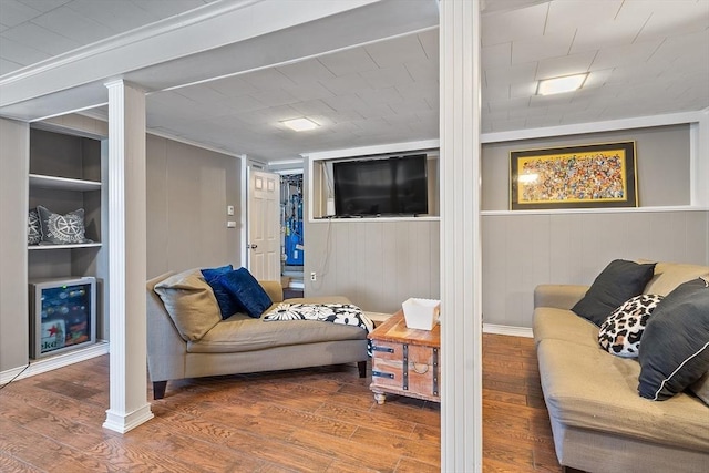 9 Crescent Ave, Lynnfield, MA 01940 - living room with wood finished floors, decorative columns, and built in shelves