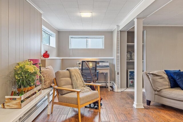 9 Crescent Ave, Lynnfield, MA 01940 - living area featuring crown molding, a baseboard radiator, wood finished floors, and wood walls