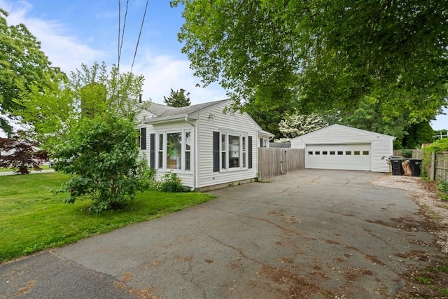 34 Coolidge St, Dartmouth, MA 02748 - view of front facade featuring a garage and an outdoor structure