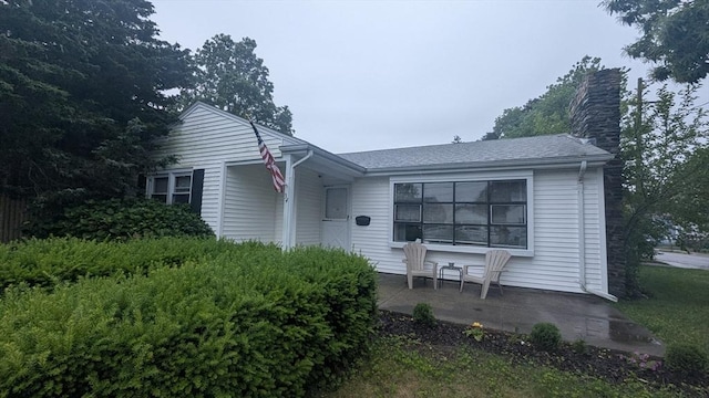34 Coolidge St, Dartmouth, MA 02748 - view of front of home featuring a chimney