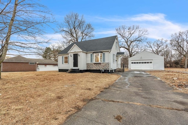 view of front of home featuring a garage and an outdoor structure