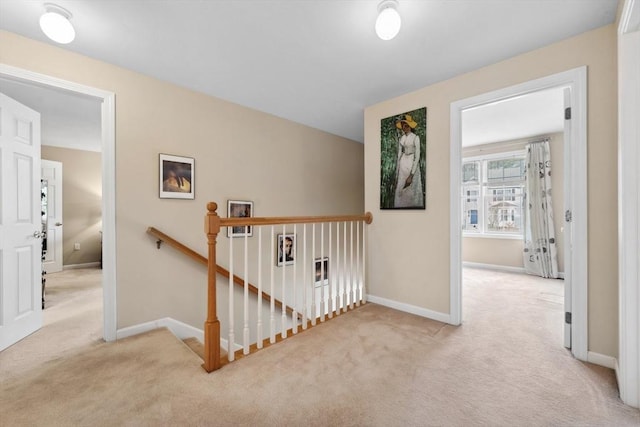 hallway featuring light carpet