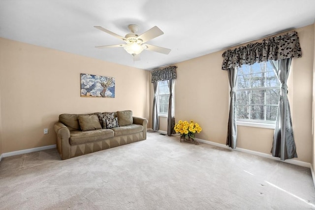 living room with ceiling fan and carpet floors