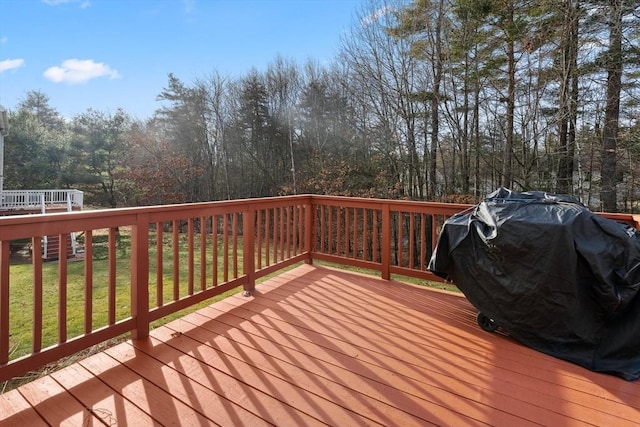 wooden terrace featuring area for grilling