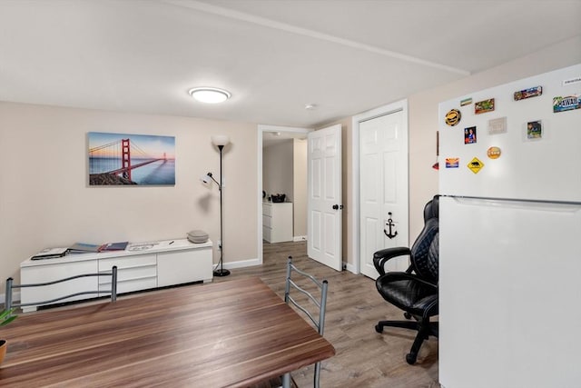 office featuring wood finished floors and baseboards